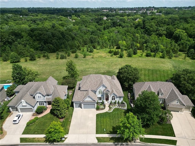 12333 Westgate St, Overland Park, KS 66213 - aerial view of property and surrounding area featuring a heavily wooded area