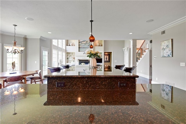 12333 Westgate St, Overland Park, KS 66213 - kitchen featuring ornamental molding, a fireplace, a chandelier, recessed lighting, and pendant lighting