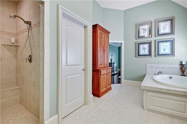 12333 Westgate St, Overland Park, KS 66213 - full bath with a tile shower, a garden tub, and tile patterned floors