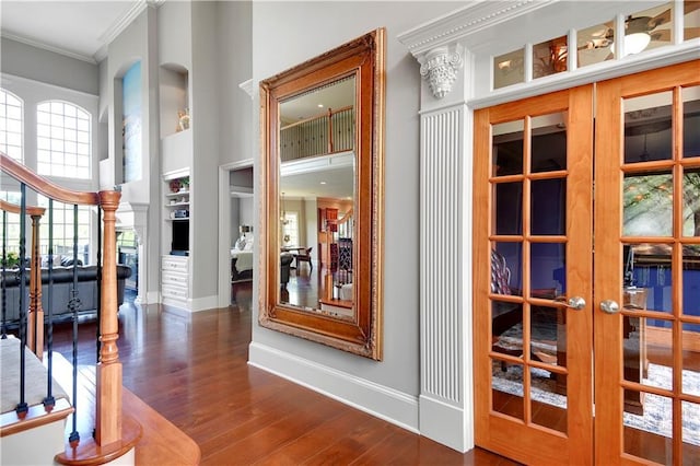 12333 Westgate St, Overland Park, KS 66213 - hall featuring crown molding, french doors, wood finished floors, and a high ceiling
