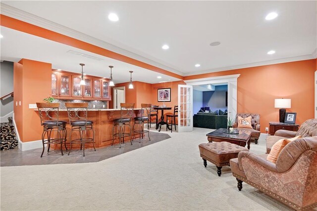 12333 Westgate St, Overland Park, KS 66213 - living room with wet bar, recessed lighting, ornamental molding, and light carpet