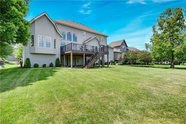 12333 Westgate St, Overland Park, KS 66213 - back of property featuring stairway, a deck, stucco siding, and a yard