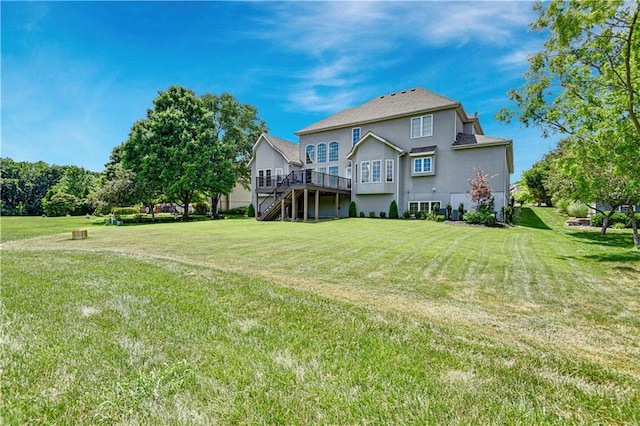 12333 Westgate St, Overland Park, KS 66213 - rear view of property with a wooden deck, a yard, stairs, and stucco siding
