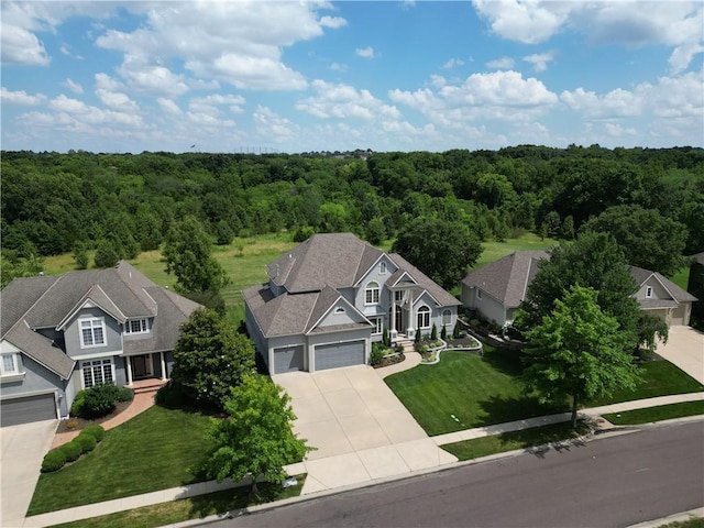12333 Westgate St, Overland Park, KS 66213 - view of subject property with a heavily wooded area