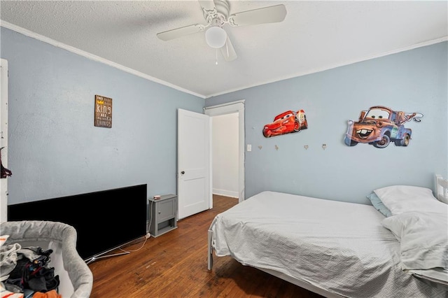 3443 Agnes Ave, Kansas City, MO 64128 - bedroom with ornamental molding, wood finished floors, and ceiling fan
