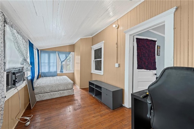 3443 Agnes Ave, Kansas City, MO 64128 - bedroom with wood-type flooring, crown molding, cooling unit, and lofted ceiling
