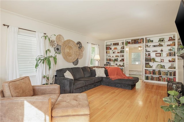 2010 Eugene Field Ave, Saint Joseph, MO 64505 - living area featuring hardwood / wood-style flooring, ornamental molding, and built in shelves