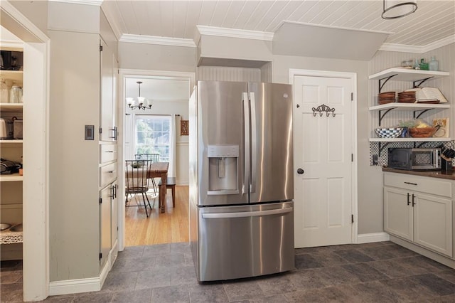 2010 Eugene Field Ave, Saint Joseph, MO 64505 - kitchen featuring stainless steel fridge with ice dispenser, ornamental molding, open shelves, a chandelier, and dark countertops