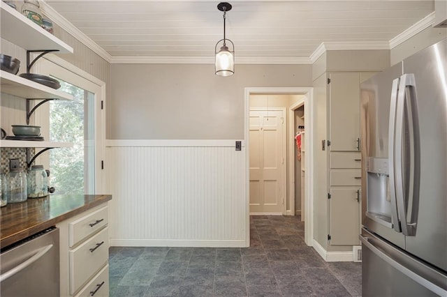 2010 Eugene Field Ave, Saint Joseph, MO 64505 - kitchen featuring stainless steel appliances, open shelves, crown molding, a wainscoted wall, and dark countertops