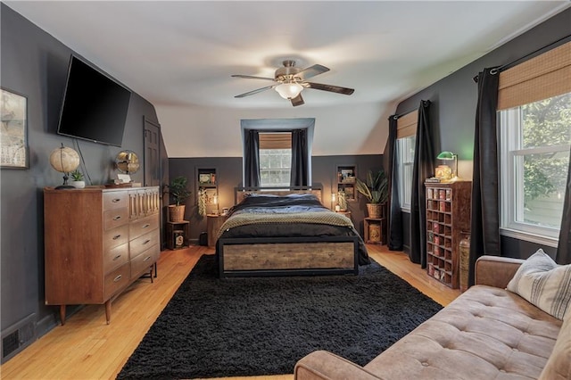 2010 Eugene Field Ave, Saint Joseph, MO 64505 - bedroom with multiple windows, light wood finished floors, and a ceiling fan