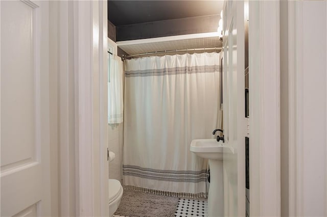 2010 Eugene Field Ave, Saint Joseph, MO 64505 - bathroom featuring a shower with curtain and tile patterned floors