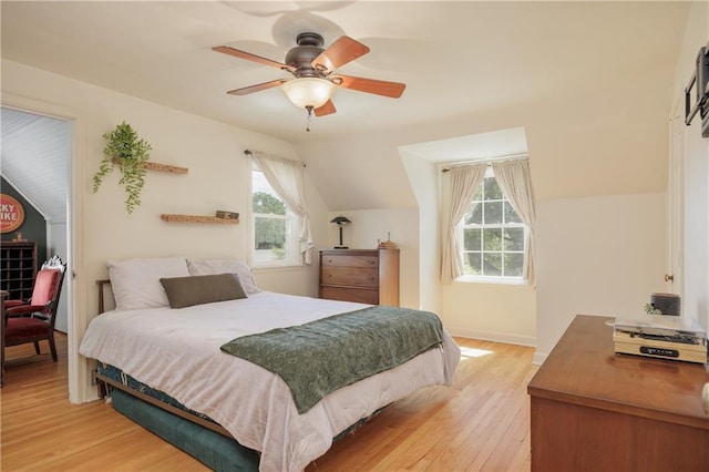 2010 Eugene Field Ave, Saint Joseph, MO 64505 - bedroom with lofted ceiling, multiple windows, light wood-style floors, and ceiling fan