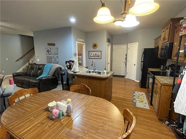 17540 W 159th Ct, Olathe, KS 66062 - dining room with wood finished floors, stairway, and recessed lighting