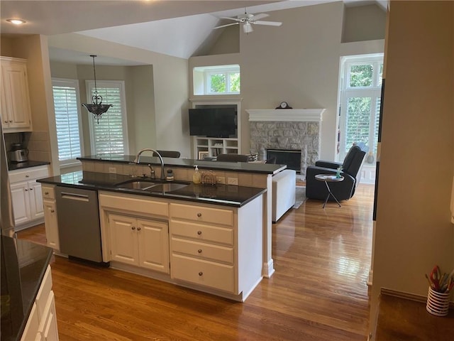 14301 Beverly St, Overland Park, KS 66223 - kitchen featuring dishwasher, dark wood-type flooring, ceiling fan, dark countertops, and vaulted ceiling