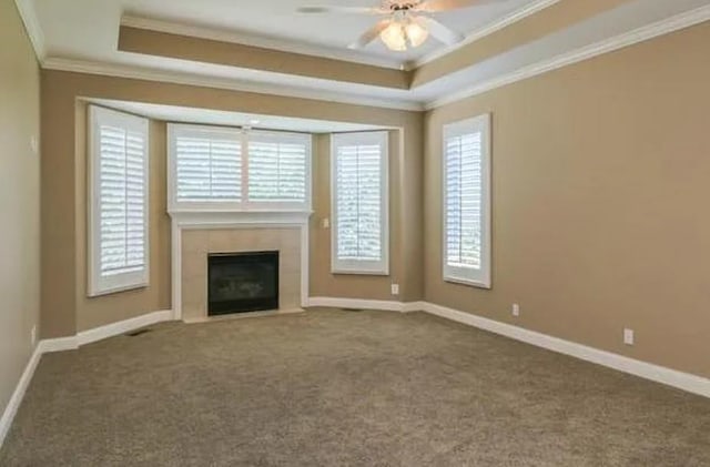 14301 Beverly St, Overland Park, KS 66223 - unfurnished living room with ornamental molding, plenty of natural light, carpet floors, and a tray ceiling