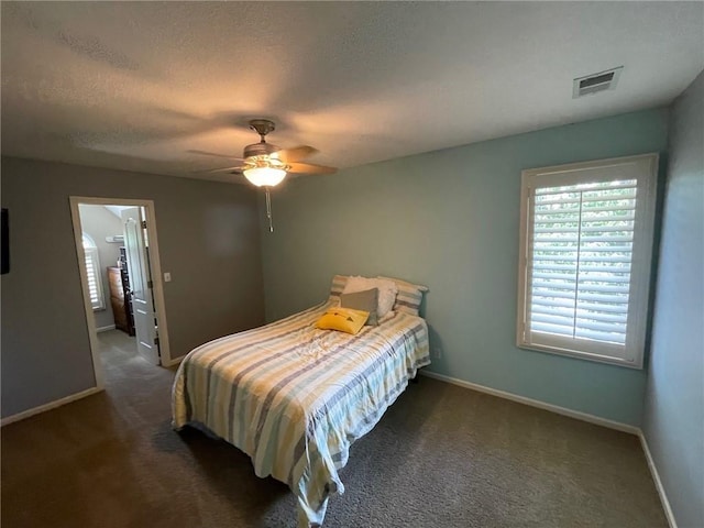 14301 Beverly St, Overland Park, KS 66223 - bedroom with carpet floors, ceiling fan, and a textured ceiling