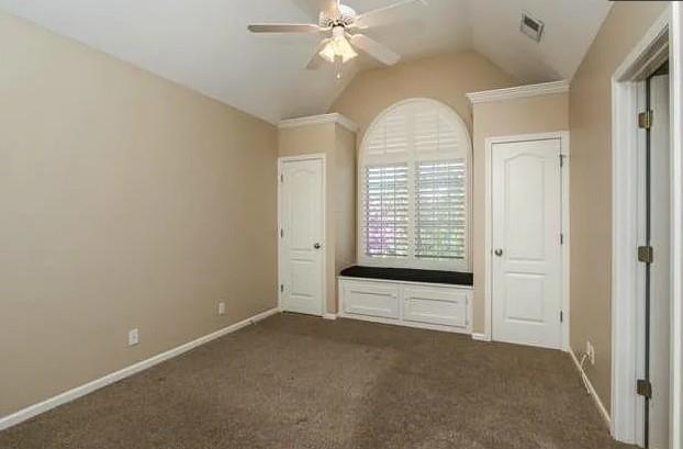 14301 Beverly St, Overland Park, KS 66223 - unfurnished bedroom with lofted ceiling and dark carpet