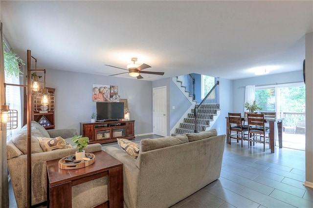 503 SW Creek Ridge Dr, Grain Valley, MO 64029 - living room featuring stairs and a ceiling fan