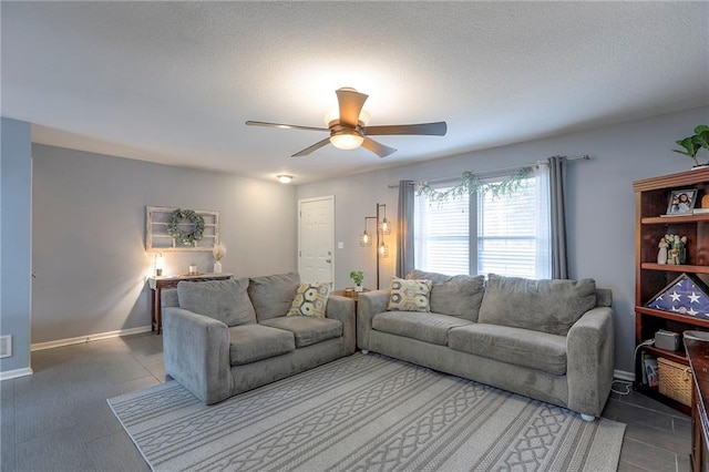 503 SW Creek Ridge Dr, Grain Valley, MO 64029 - living area with ceiling fan and a textured ceiling