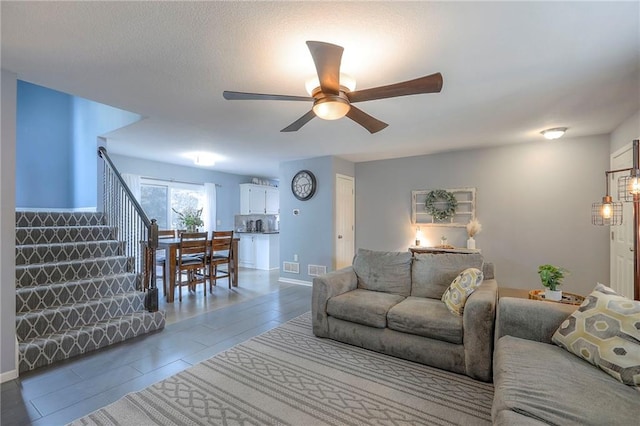 503 SW Creek Ridge Dr, Grain Valley, MO 64029 - living room featuring stairs and ceiling fan