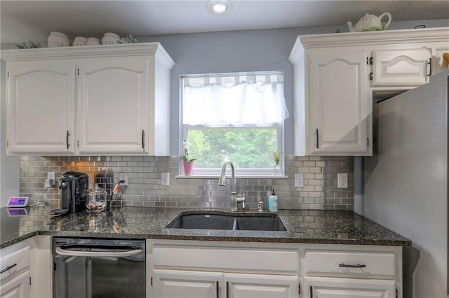 503 SW Creek Ridge Dr, Grain Valley, MO 64029 - kitchen with dishwashing machine, freestanding refrigerator, and white cabinetry
