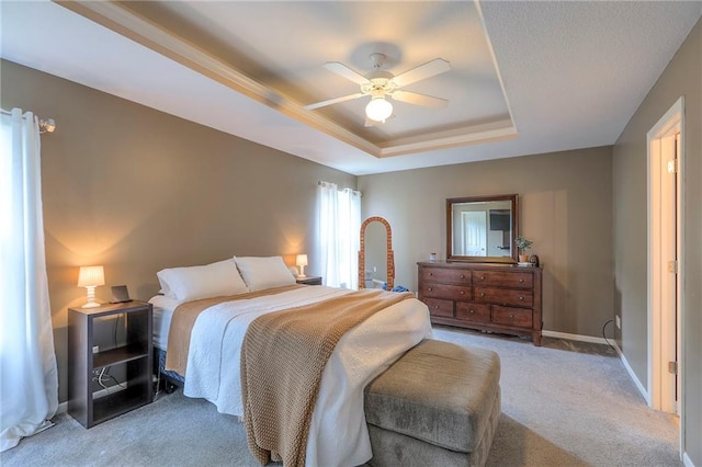 503 SW Creek Ridge Dr, Grain Valley, MO 64029 - bedroom with a tray ceiling, carpet, and a ceiling fan