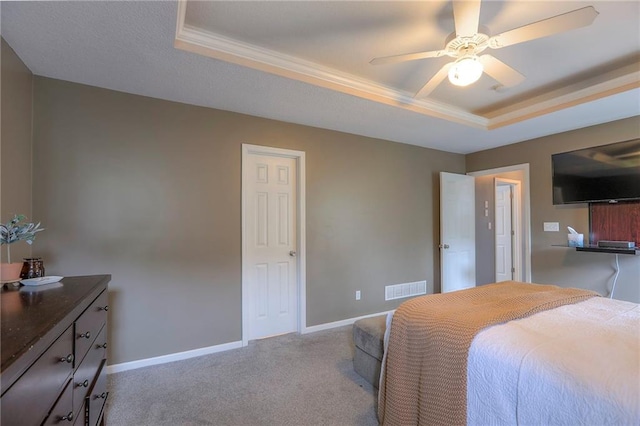 503 SW Creek Ridge Dr, Grain Valley, MO 64029 - carpeted bedroom with a tray ceiling, crown molding, and a ceiling fan