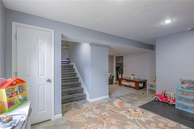 503 SW Creek Ridge Dr, Grain Valley, MO 64029 - rec room with a textured ceiling and recessed lighting