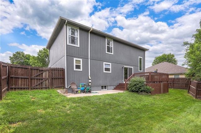 503 SW Creek Ridge Dr, Grain Valley, MO 64029 - back of property featuring a fenced backyard, a wooden deck, and a patio