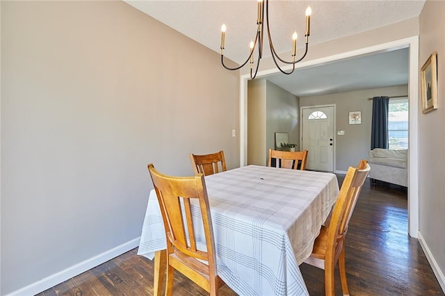 7725 Cleveland Ave, Kansas City, KS 66109 - dining space featuring a chandelier and dark wood-style floors