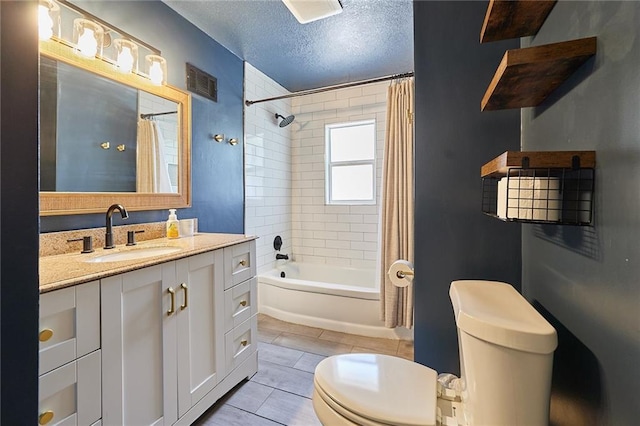 7725 Cleveland Ave, Kansas City, KS 66109 - full bathroom featuring vanity, shower / bath combo, tile patterned flooring, and a textured ceiling