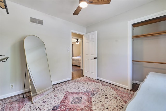 7725 Cleveland Ave, Kansas City, KS 66109 - unfurnished bedroom featuring a closet, ceiling fan, and wood finished floors