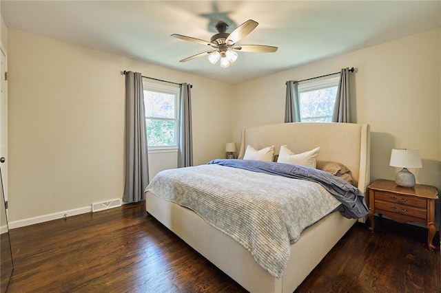 7725 Cleveland Ave, Kansas City, KS 66109 - bedroom with multiple windows, wood finished floors, and ceiling fan