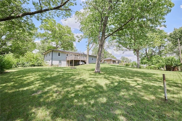 7725 Cleveland Ave, Kansas City, KS 66109 - view of green lawn featuring a wooden deck