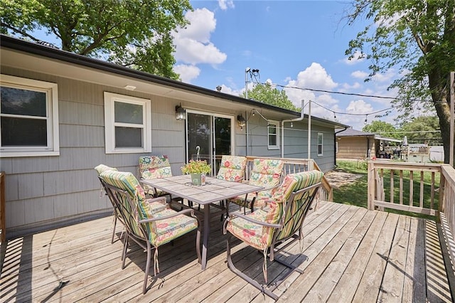 7725 Cleveland Ave, Kansas City, KS 66109 - wooden terrace with outdoor dining space