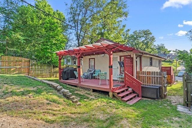 3021 Topping Ave, Kansas City, MO 64129 - view of front facade featuring a fenced backyard, a deck, and a pergola