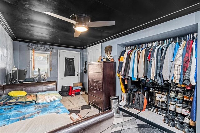 3021 Topping Ave, Kansas City, MO 64129 - tiled bedroom featuring ceiling fan