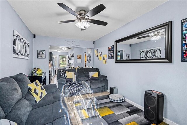 3021 Topping Ave, Kansas City, MO 64129 - living room with a ceiling fan and baseboards
