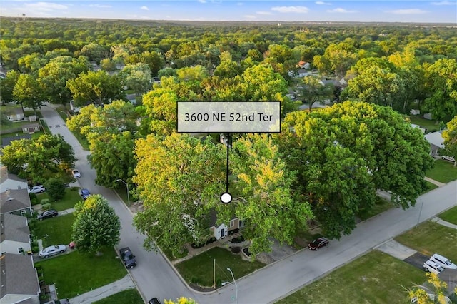 3600 NE 52nd Ter, Kansas City, MO 64119 - aerial overview of property's location with a forest