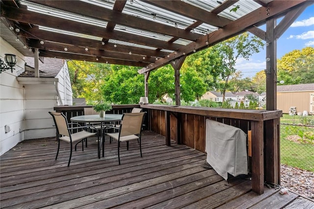 3600 NE 52nd Ter, Kansas City, MO 64119 - wooden deck featuring a pergola and outdoor dining area