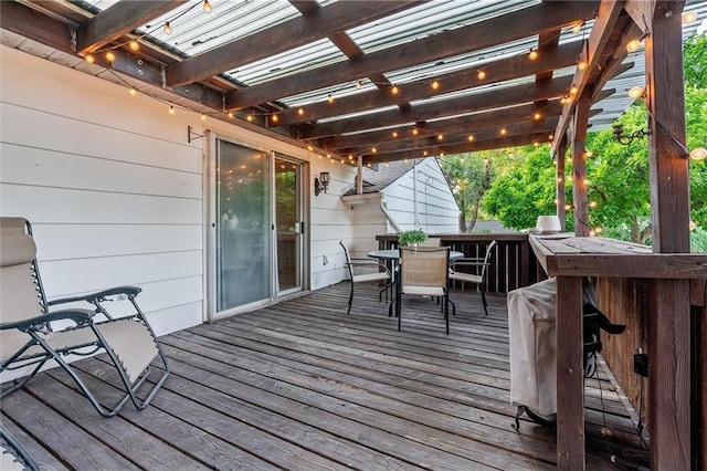 3600 NE 52nd Ter, Kansas City, MO 64119 - wooden deck featuring outdoor dining area and a pergola