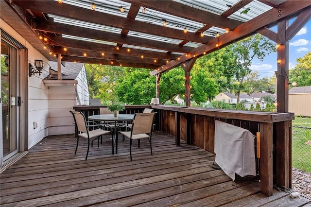 3600 NE 52nd Ter, Kansas City, MO 64119 - wooden terrace featuring a pergola and outdoor dining space