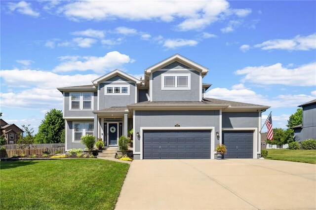 14920 S Roxburghe St, Olathe, KS 66061 - view of front of home featuring stucco siding, driveway, and an attached garage
