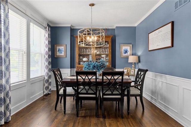 14920 S Roxburghe St, Olathe, KS 66061 - dining space with a chandelier, plenty of natural light, dark wood-style floors, wainscoting, and crown molding