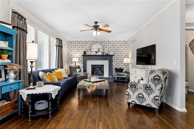 14920 S Roxburghe St, Olathe, KS 66061 - living area featuring wood finished floors, a ceiling fan, crown molding, and a glass covered fireplace