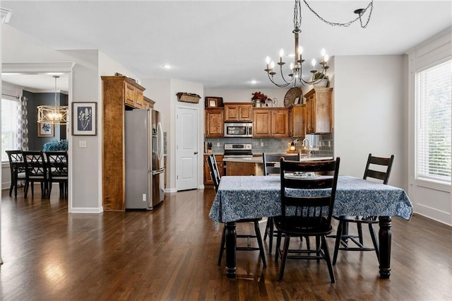 14920 S Roxburghe St, Olathe, KS 66061 - dining room with a chandelier, dark wood finished floors, plenty of natural light, and recessed lighting