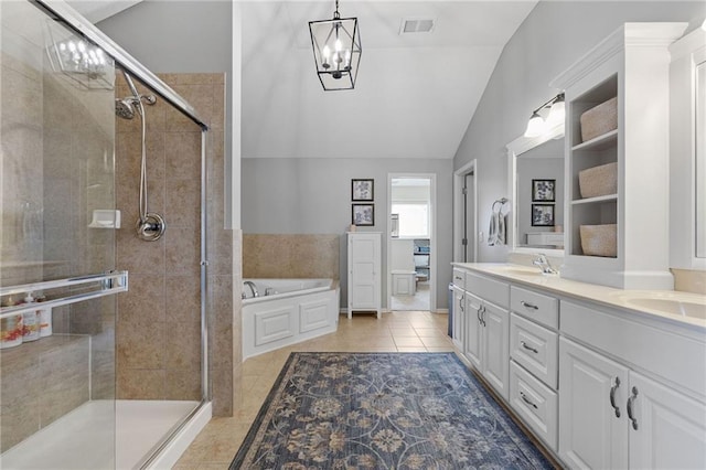 14920 S Roxburghe St, Olathe, KS 66061 - full bath with a garden tub, a chandelier, a shower stall, lofted ceiling, and double vanity
