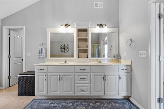 14920 S Roxburghe St, Olathe, KS 66061 - full bath with double vanity, an enclosed shower, vaulted ceiling, and tile patterned flooring