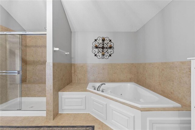 14920 S Roxburghe St, Olathe, KS 66061 - full bath with a whirlpool tub, a shower stall, tile patterned floors, and tile walls