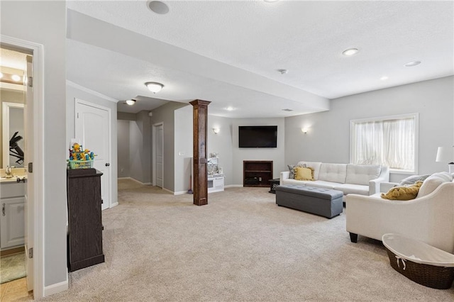 14920 S Roxburghe St, Olathe, KS 66061 - living area featuring light carpet, a textured ceiling, recessed lighting, and ornate columns